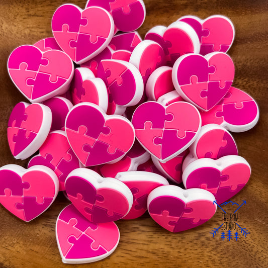 Pink ribbon awareness puzzle piece heart focal